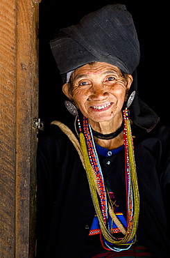 Woman of the Ann tribe in traditional black dress and colourful beads in a hill village near Kengtung (Kyaingtong), Shan State, Myanmar (Burma), Asia