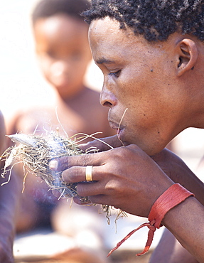 San (Bushman) demonstrating traditional fire lighting technique at the Okahandja Cultural Village, near Okahandja town, Namibia, Africa 