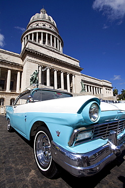 Blue vintage American car parked opposite The Capitolio, Havana Centro, Havana, Cuba, West Indies, Central America