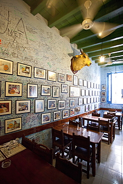 Interior of Bogadito del Medio, walls covered in graffiti, one of late author Ernest Hemingway's favourite bars, Havana Viejo, Havana, Cuba, West Indies, Central America 