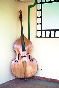 Double bass in restaurant, Vinales, Pinar Del Rio Province, Cuba, West Indies, Central America 