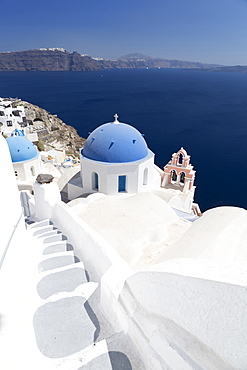 Steps leading to white church with blue dome overlooking the Caldera, Oia, Santorini, Cyclades, Greek Islands, Greece, Europe