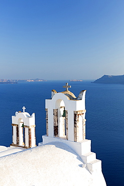 White church belltowers overlooking the Caldera, Oia, Santorini, Cyclades, Greek Islands, Greece, Europe