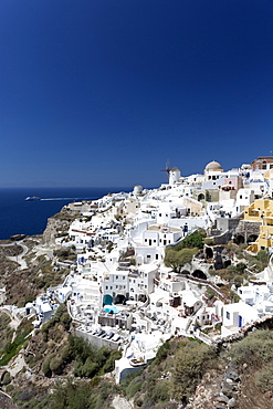 Classic view of the village of Oia with its windmill and whitewashed houses, Oia, Santorini, Cyclades, Greek Islands, Greece, Europe