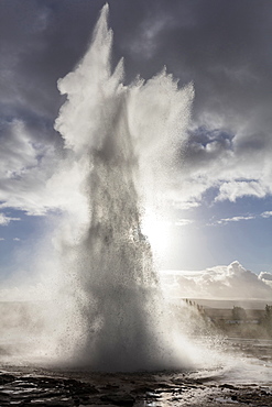 Strokkur Geysir erupting against stormy sky, Geysir, South West Iceland, Polar Regions