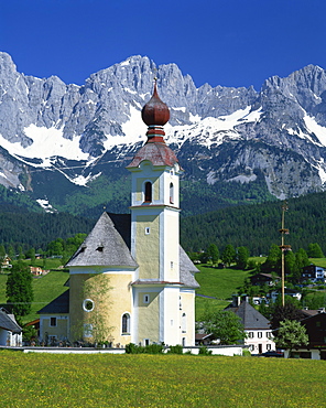 Church with onion dome at Going, with mountains behind, in the Tirol, Austria, Europe