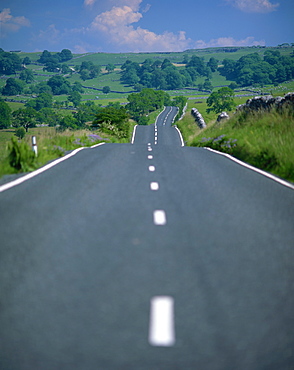 Undulating rural road through countryside, United Kingdom, Europe