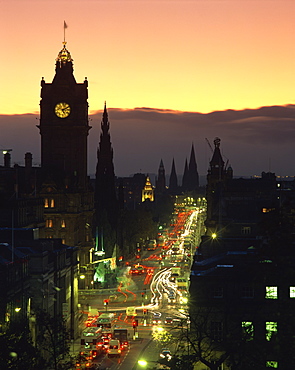 Aerial view over Princes Street at dusk, including the silhouetted Waverley Hotel clock tower, Edinburgh, Lothian, Scotland, United Kingdom, Europe