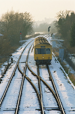 Train on snowy tracks, Norfolk, England, United Kingdom, Europe