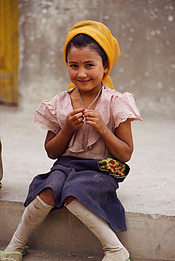 Portrait of a smiling Tadjik girl at Tashkurghan, China, Asia