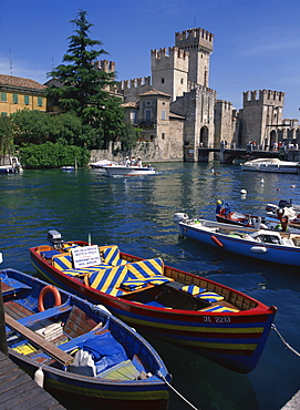 Moored boats in the harbour at Sirmione on Lake Garda, Lombardia, Italy, Europe