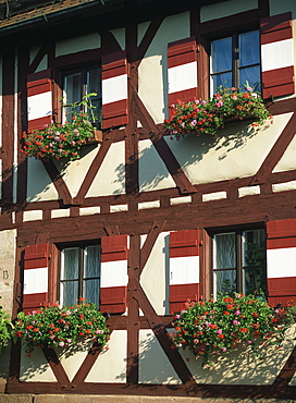 Flower baskets on half-timbered wall, Kaiserburg, Nuremberg, Bavaria, Germany, Europe