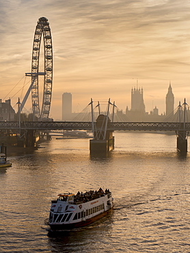 Millennium Wheel stands with Big Ben and tour boat at sunset, London, England, United Kingdom, Europe