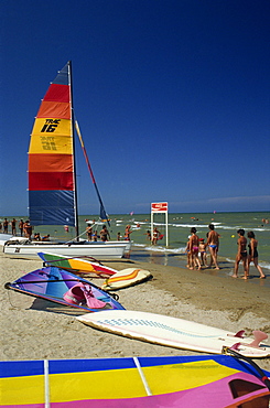 Sailing boats and windsurfing boards on beach at Rimini, Emilia Romagna, Italy, Europe