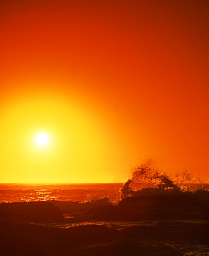 Sunset over the Indian Ocean, with waves breaking on coastline of Prevwlly, Western Australia, Australia, Pacific