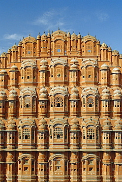 Detail of the facade of the Palace of the Winds or Hawa Mahal, showing windows for ladies in purdur to watch from, Jaipur, Rajasthan, India 