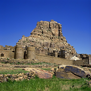 Walls and city below fortress on top of the mountain at Thulla, Yemen, Middle East