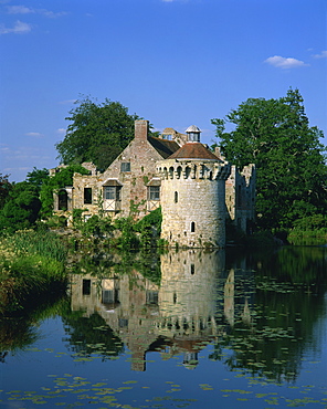 Castle reflected in lake, Scotney Castle, near Lamberhurst, Kent, England, United Kingdom, Europe