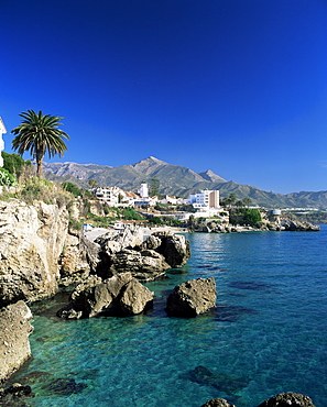 View along rock coast to town and mountains, Nerja, Malaga, Andalucia, Spain, Mediterranean, Europe