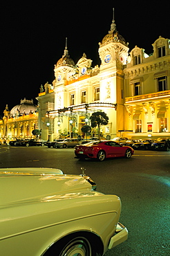 Rolls Royce and Ferrari parked in front of the Casino at night, Monte Carlo, Monaco, Mediterranean, Europe