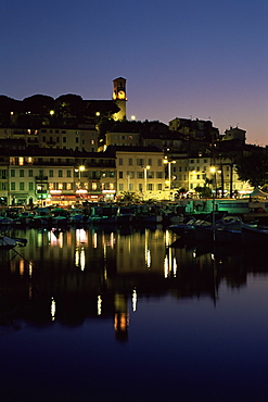 View across harbour to the old quarter of Le Suquet, at night, Cannes, Alpes-Maritimes, Cote d'Azur, French Riviera, France, Mediterranean, Europe