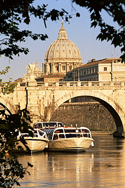 Pleasure boats on the River Tiber near the Ponte Sant'Angelo, with St. Peter's Basilica behind, Rome, Lazio, Italy, Europe