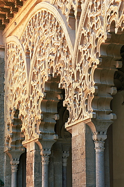 Intricately carved Moorish architecture lining the Patio de Santa Isabel, The Aljaferia, Zaragoza, Aragon, Spain, Europe