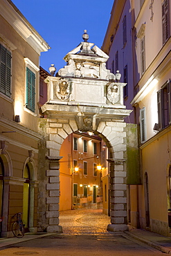 The Balbi Arch and pedestrianized Grisia illuminated at dusk, Rovinj (Rovigno), Istria, Croatia, Europe