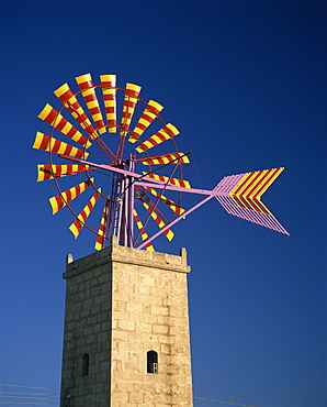 Windmill with sails in the colours of the Mallorcan flag, near Palma, Mallorca, Balearic Islands, Spain, Europe