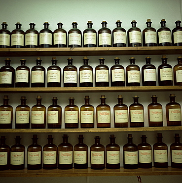 Shelves of old essence bottles, Parfumerie Fragonard, Grasse, Alpes Maritimes, Provence, France, Europe