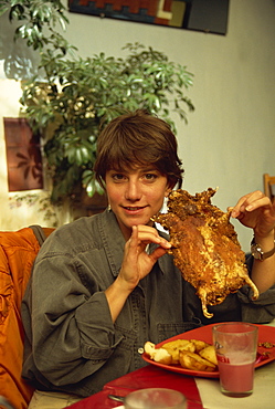 Enjoying a guinea pig lunch, Cuzco, Peru, South America