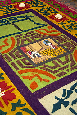 Close-up of coloured sawdust rug on the street on Good Friday during Semana Santa in Antigua, Guatemala, Central America