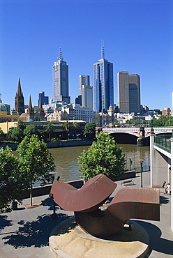 Sculpture on Yarra River embankment and city skyline, Melbourne, Victoria, Australia, Pacific