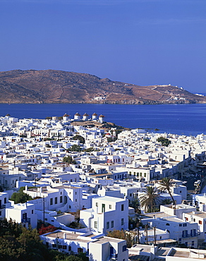 White houses and windmills, with the sea and hills in the background, on Mykonos, Cyclades Islands, Greek Islands, Greece, Europe