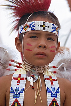 Portrait of young Crow indian boy in traditional costume, New Mexico, United States of America, North America