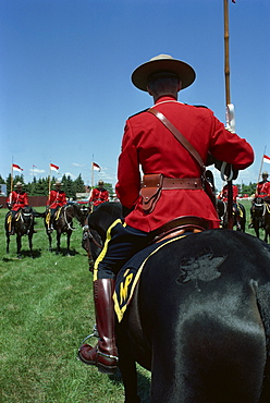 Mounties on horseback during roll call and instructions before performance of show number Musical Ride, at Regina, Saskatchewan, Canada, North America