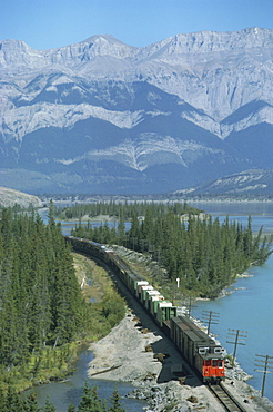 Canadian National Railways goods train along Athabasca River, Jasper National Park, UNESCO World Heritage Site, Alberta, Rocky Mountains, Canada, North America