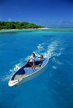 Man driving small boat, Maninita Island, Vava'u Group, Tonga, Pacific Islands, Pacific