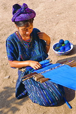 Girl weaving traditional huipil, Santa Caterina Papopo, Guatemala, Central America