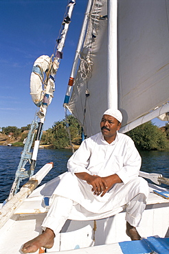 Felucca captain on boat, near Kitchener's Island, Aswan, Egypt, North Africa, Africa