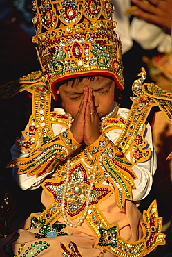 Boy about to become a monk, Shwedagon Pagoda, Yangon (Rangoon), Myanmar (Burma), Asia