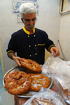 Traditional surouk (flat doughnuts) baker, Yazd, Iran, Middle East