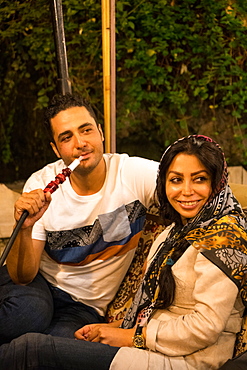 Couple on night out in traditional restaurant, Darband, Northern Tehran, Iran, Middle East