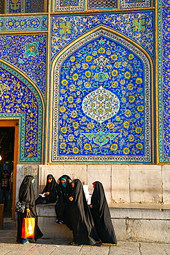 Girls gossiping after shopping in the Grand Bazaar, by entrance of Sheikh Lotfollah Mosque, Isfahan, Iran, Middle East