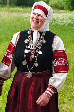 Mature Seto woman, singing polyphonically at Feast Day of St. Peter and St. Paul, Uusvada, Setomaa, SE Estonia, Europe