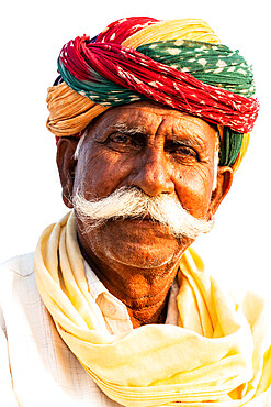 Distinguished senior horse trader with remarkable moustache and brightly multi-coloured turban, at the annual Chandrabhaga Fair, Rajasthan, India, Asia