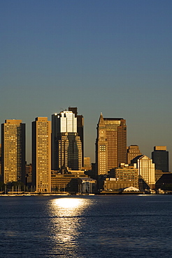 City skyline across Boston Harbor at dawn, Boston, Massachusetts, USA