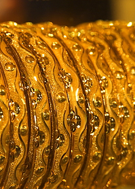 Close up of gold bangles on display, the Gold Souk, Deira, Dubai, United Arab Emirates, Middle East