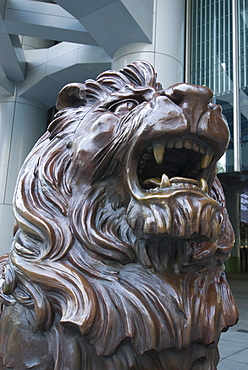 Bronze lion statue outside the HSBC Bank Headquarters, rubbing its paws is said to bring good luck, Central, Hong Kong, China, Asia