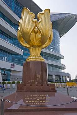 Golden bauhinia flower monument, a gift from the People's Republic of China to celebrate the handover from British to Chinese rule in 1997, and Convention and Exhibition Centre, Golden Bauhinia Square, Wanchai, Hong Kong, China, Asia